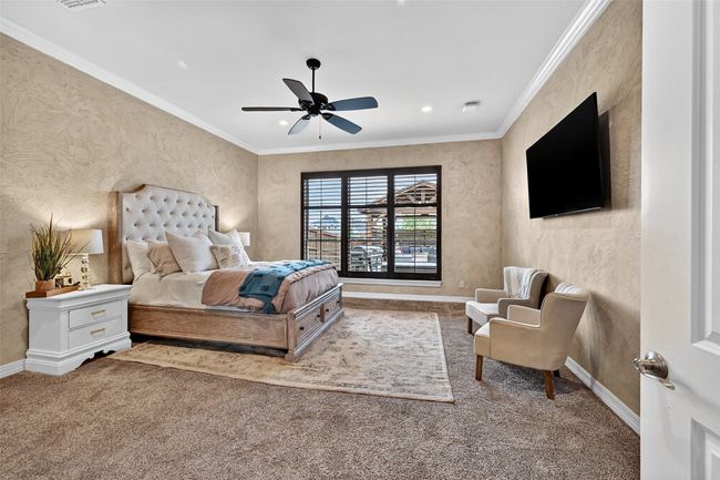 Carpeted bedroom featuring ornamental molding, ceiling fan, and recessed lighting | Image 19
