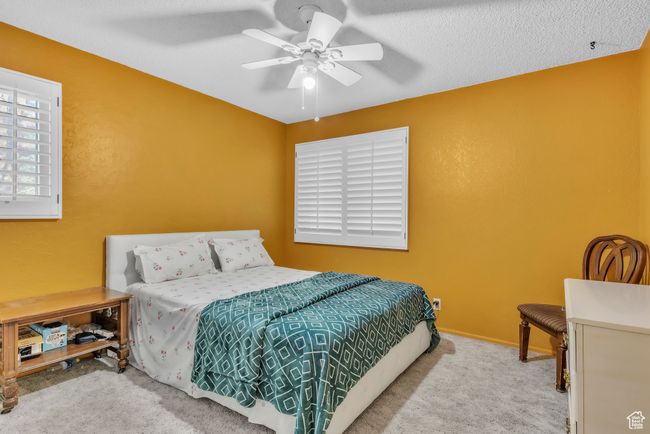 Carpeted bedroom featuring a ceiling fan | Image 17