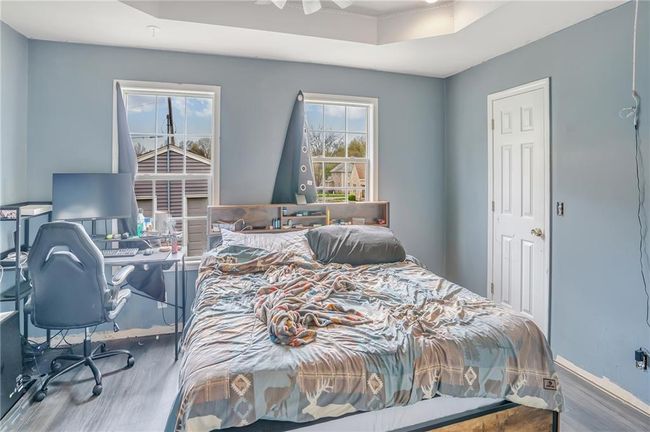 Bedroom featuring wood finished floors | Image 9