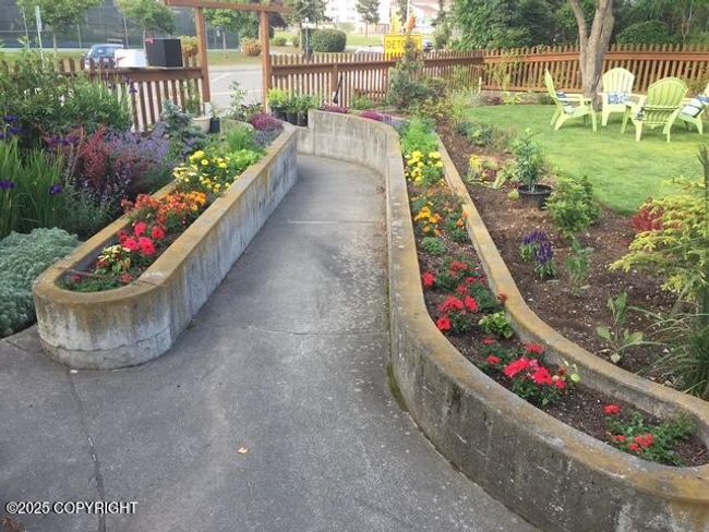 Raised Flower Beds Line the Walkway | Image 5