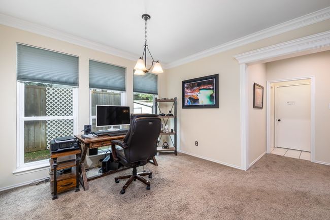 Seller is using formal dining as his home office. | Image 8