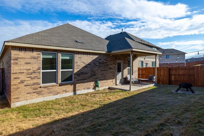 Rear view of property with a yard and a patio | Image 8