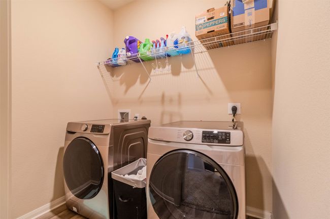 Washroom featuring washer and clothes dryer | Image 21