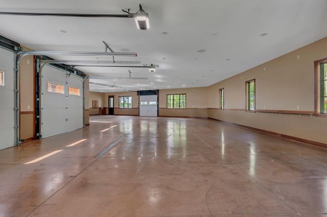 Garage door to the lakeside of the home. | Image 84
