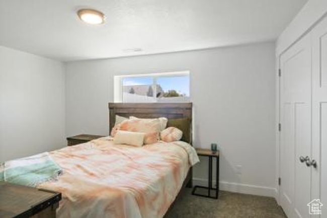 Carpeted bedroom with a closet and baseboards | Image 22