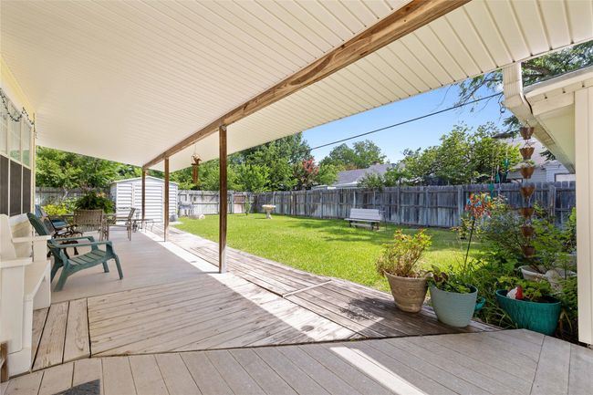Extensive covered back porch. | Image 29