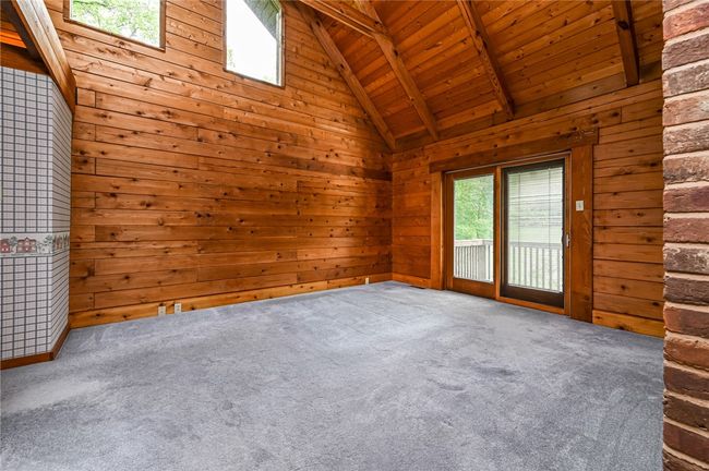 Primary bedroom with sliding doors to a private deck | Image 9