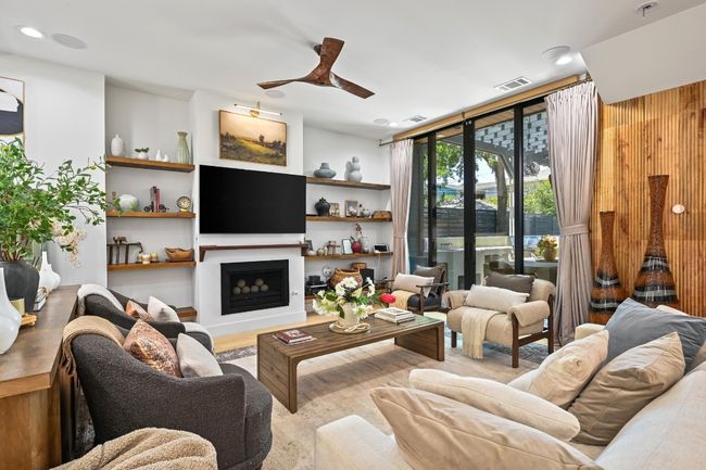 View of living area and doors that lead to outside. | Image 6