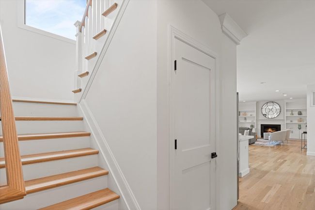Stairs featuring hardwood / wood-style floors and built in features | Image 15