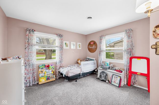 carpeted bedroom with visible vents | Image 25