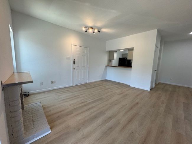 Unfurnished living room featuring light wood finished floors | Image 15