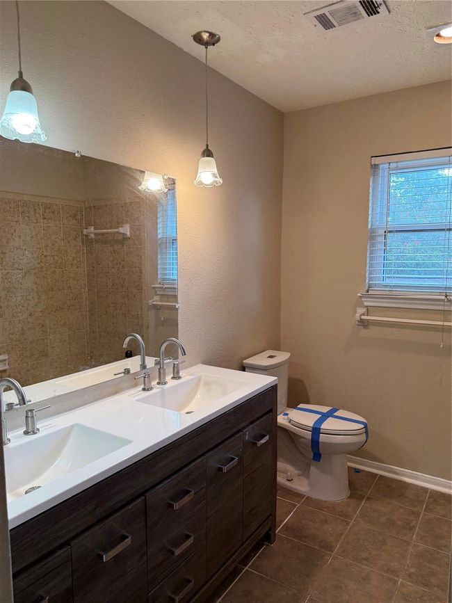 Secondary bathroom tub with custom tile surround. | Image 32