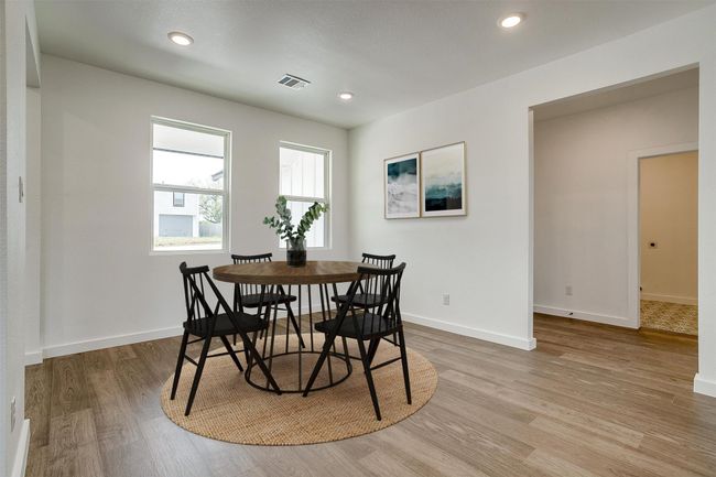 Dining area featuring recessed lighting, baseboards, visible vents, and light wood-style floors | Image 6