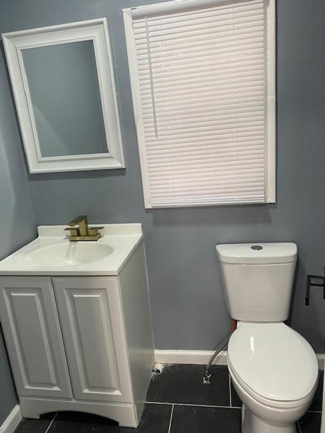Bathroom featuring vanity and toilet | Image 27