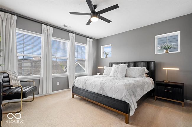 Primary Suite that offers a ensuite bathroom and custom closet | Image 18
