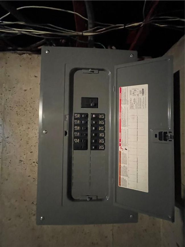 Utility room featuring electric panel | Image 33