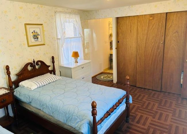 Bedroom featuring dark parquet floors | Image 13