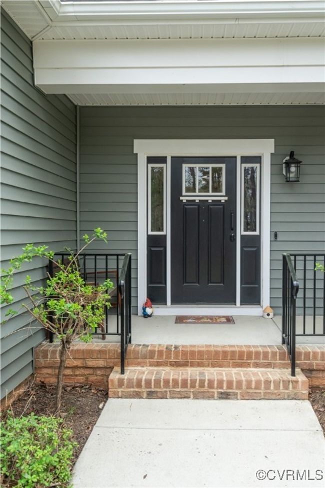 View of exterior entry featuring covered porch | Image 5