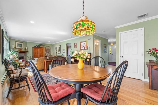 Dining area open to kitchen and family room. | Image 10