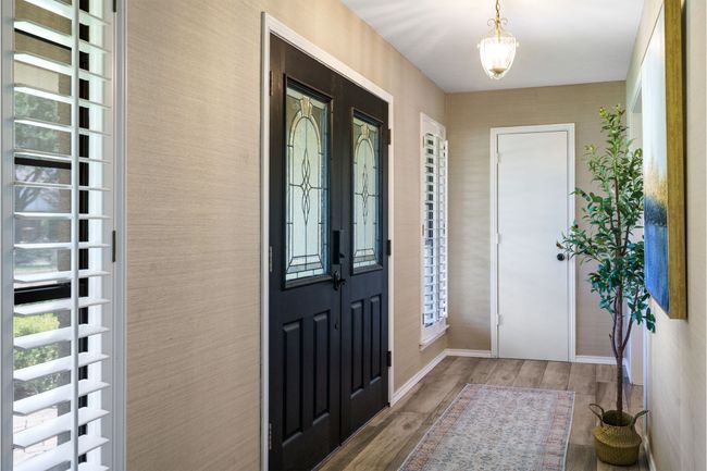 Entryway with wood look tile floors, plenty of natural light | Image 8
