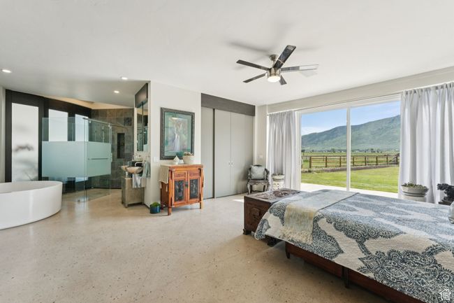 Bedroom featuring a mountain view, access to exterior, recessed lighting, a closet, and ceiling fan | Image 17
