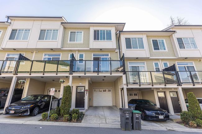 Multi unit property with an attached garage and driveway | Image 29