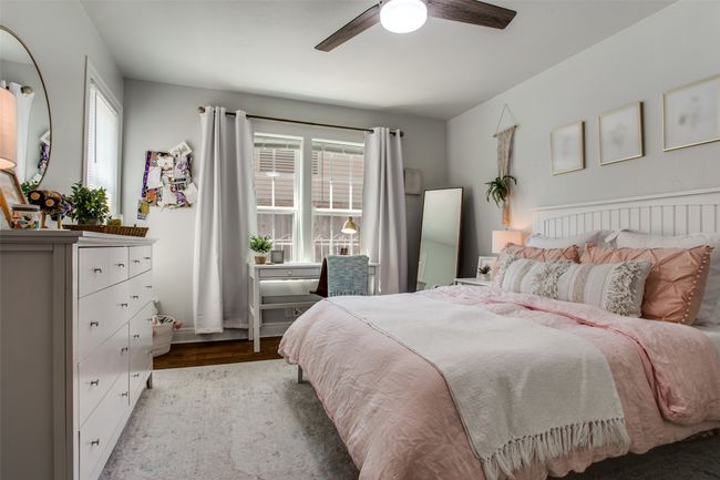 Bedroom with wood finished floors and ceiling fan | Image 20