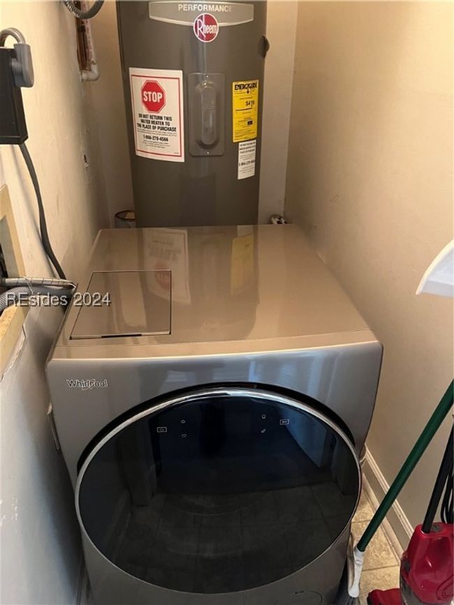 Laundry area with water heater | Image 16