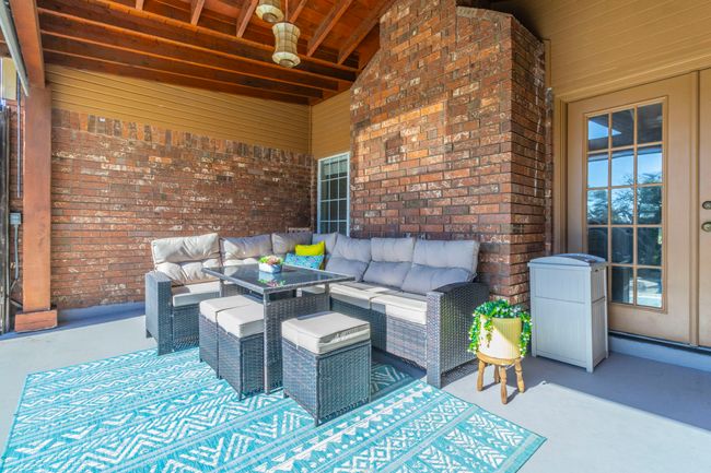 View of patio with an outdoor hangout area | Image 31