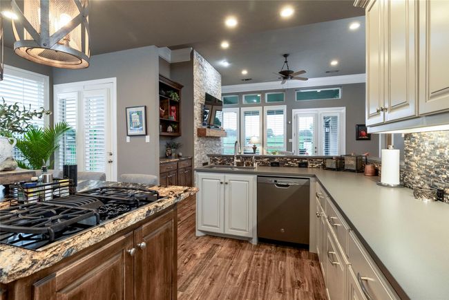 Kitchen with a view of the living room | Image 8