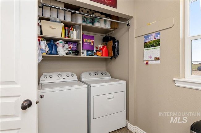 Laundry room with independent washer and dryer and baseboards | Image 21