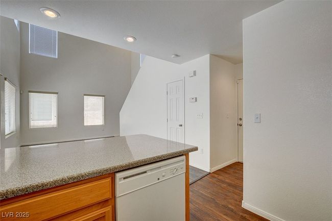 Kitchen featuring visible vents, baseboards, dishwasher, recessed lighting, and dark wood-type flooring | Image 13