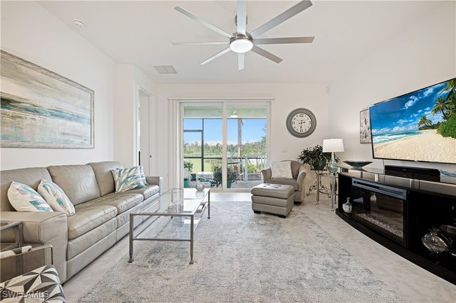 Living room featuring ceiling fan | Image 9