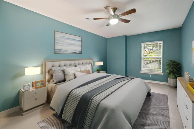 Oversized secondary bedroom with walk-in closet, ceiling fan, and direct access to the bathroom. | Image 23