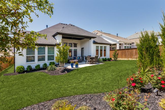 Back of house with roof with shingles, a fenced backyard, and a patio area | Image 39