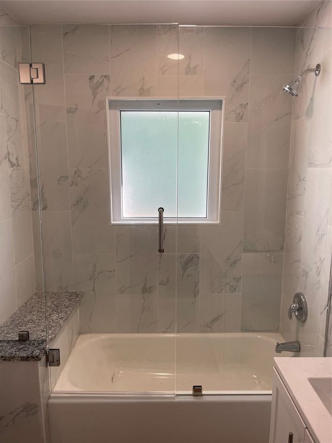 Full bath featuring vanity and bath / shower combo with glass door | Image 11