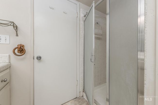 Bathroom with a stall shower and vanity | Image 25