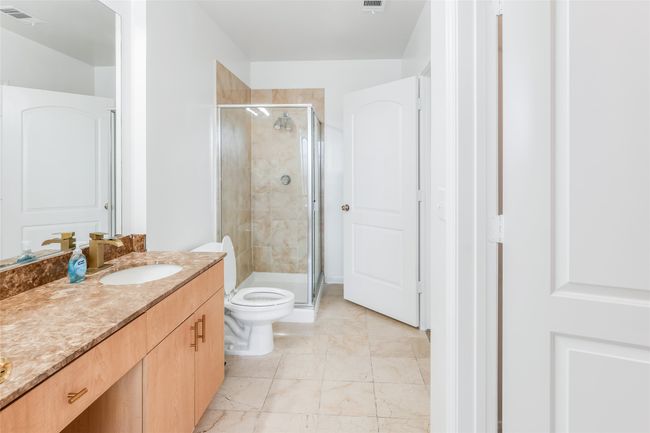 Full bathroom featuring vanity and a stall shower | Image 25