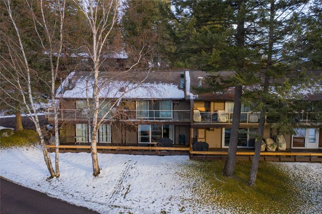 Snow covered house with a balcony | Image 20