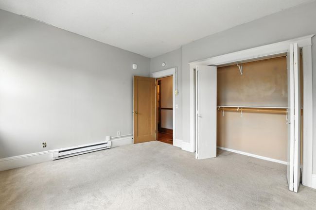 Ample closet space with dual hanging rods, perfect for maximizing storage. | Image 22