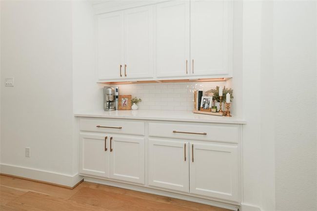 Efficient kitchen storage and sleek work area. | Image 4