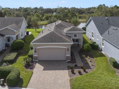 Aerial front view of home w/ water & conservation area view | Image 1