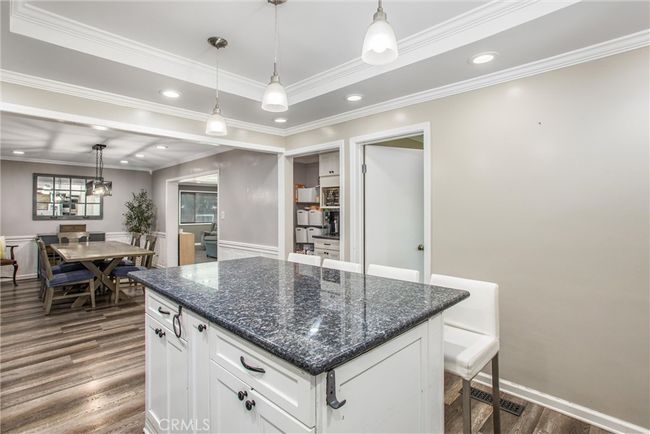 A view of the dining area from the kitchen. | Image 16