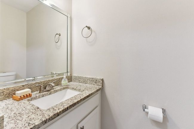 Half bath featuring toilet and vanity | Image 25