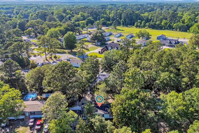 Aerial overview of property's location with a heavily wooded area | Image 30
