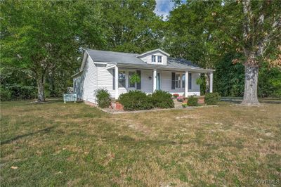 View of front of home with a porch and a front yard | Image 2