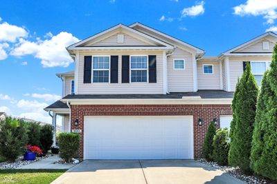 Spacious 2 car garage with extra ceiling storage allowing two cars to easily park in the garage. | Image 2