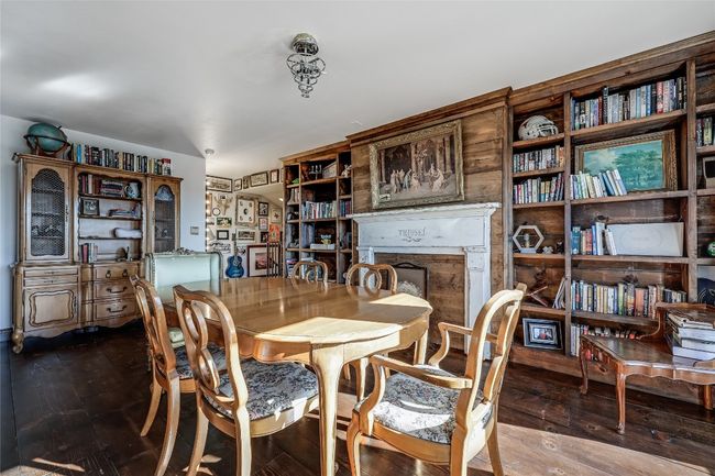 Dining room featuring a fireplace and wood-type flooring | Image 16