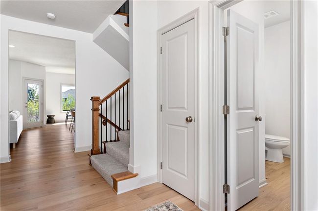 NOT ACTUAL HOME: Entryway with half bath and coat closet | Image 5