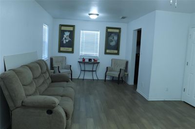 Living room featuring hardwood / wood-style flooring | Image 3